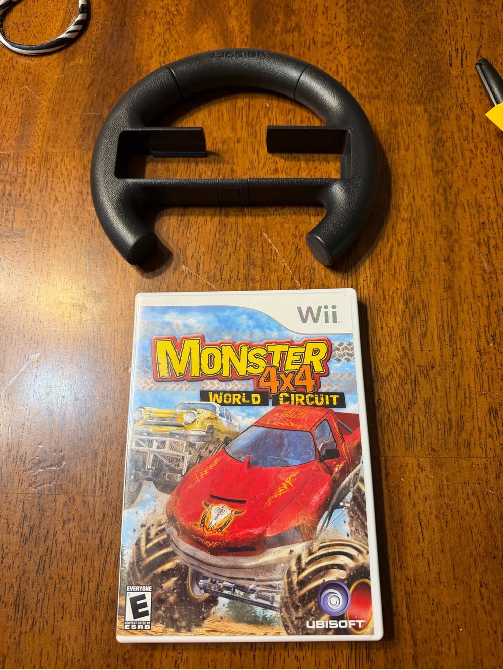 Wii Monster 4x4: Worldโ Circuit (Wii) - Black Ubisoft Steering Wheel Included